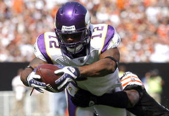 CLEVELAND - SEPTEMBER 13:  Percy Harvin #12 of the Minnesota Vikings dives for a touchdown as he is hit Brodney Pool #21 of the Cleveland Browns at Cleveland Browns Stadium on September 13, 2009 in Cleveland, Ohio.  (Photo by Matt Sullivan/Getty Images)