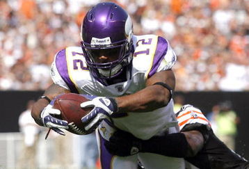 CLEVELAND - SEPTEMBER 13:  Percy Harvin #12 of the Minnesota Vikings dives for a touchdown as he is hit Brodney Pool #21 of the Cleveland Browns at Cleveland Browns Stadium on September 13, 2009 in Cleveland, Ohio.  (Photo by Matt Sullivan/Getty Images)