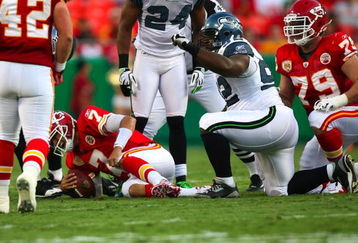 KANSAS CITY, MO - AUGUST 29: Quarterback Matt Cassel #7 of the Kansas City Chiefs grimaces as he grabs his left leg after he was sacked in the first quarter by Brandon Mebane #92 of the Seattle Seahawks during their preseason game at Arrowhead Stadium on August 29, 2009 in Kansas City, Missouri. (Photo by Dilip Vishwanat/Getty Images)
