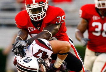 ATHENS, GA - SEPTEMBER 12:  Rennie Curran #35 and Bryan Evans #3 of the Georgia Bulldogs tackle Patrick DiMarco #47 of the South Carolina Gamecocks at Sanford Stadium on September 12, 2009 in Athens, Georgia.  (Photo by Kevin C. Cox/Getty Images)