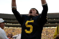 ANN ARBOR, MI - SEPTEMBER 12:  Quarterback Tate Forcier #5 celebrates with seconds left in the game against Notre Dame at Michigan Stadium on September 12, 2009 in Ann Arbor, Michigan.  (Photo by Domenic Centofanti/Getty Images)
