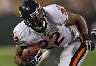GREEN BAY, WI - SEPTEMBER 13: Matt Forte #22 of the Chicago Bears tries to gain yardage against the Green Bay Packers on September 13, 2009 at Lambeau Field in Green Bay, Wisconsin. The Packers defeated the Bears 21-15. (Photo by Jonathan Daniel/Getty Images)