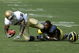 ANN ARBOR, MI - SEPTEMBER 12:  Wide receiver Armando Allen #5 of Notre Dame is tackled by cornerback Donovan Warren #6 of Michigan at Michigan Stadium on September 12, 2009 in Ann Arbor, Michigan.  (Photo by Domenic Centofanti/Getty Images)