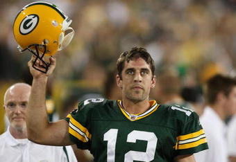 GREEN BAY, WI - SEPTEMBER 13: Aaron Rodgers #12 of the Green Bay Packers celebrates throwing the winning touchdown pass against the Chicago Bears on September 13, 2009 at Lambeau Field in Green Bay, Wisconsin. The Packers defeated the Bears 21-15. (Photo by Jonathan Daniel/Getty Images)