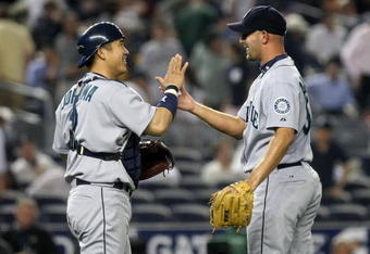 NEW YORK - JULY 02: Kenji Johjima #2 of the Seattle Mariners celebrates the win with pitcher David Aardsma #53 against the New York Yankees on July 2, 2009 at Yankee Stadium in the Bronx borough of New York City.  (Photo by Nick Laham/Getty Images)