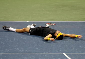 NEW YORK - SEPTEMBER 14:  Juan Martin Del Potro of Argentina celebrates championship point after defeating Roger Federer of Switzerland in the Men's Singles final on day fifteen of the 2009 U.S. Open at the USTA Billie Jean King National Tennis Center on September 14, 2009 in the Flushing neighborhood of the Queens borough of New York City. Del Potro defeated Federer 3-6, 7-6 (7), 4-6, 7-6 (7), 6-2.  (Photo by Nick Laham/Getty Images)