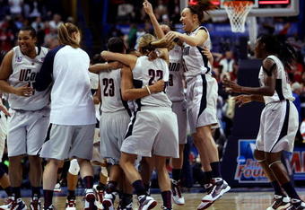 ST. LOUIS - APRIL 07:  The Connecticut Huskies celebrate the win during the NCAA Women's Final Four Championship game at the Scottrade Center against the Louisville Cardinals on April 7, 2009 in St. Louis, Missouri. The Connecticut Huskies defeated the Louisville Cardinals 76-54 to win the national title. The Huskies were undefeated this season.  (Photo by Elsa/Getty Images)