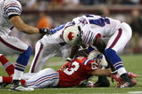 FOXBORO, MA - SEPTEMBER 14:  Wes Welker #83 of the New England Patriots reaches for a loose ball against Bryan Scott #43 and Leodis McKelvin #28 of the Buffalo Bills on September 14, 2009 at Gillette Stadium in Foxboro, Massachusetts. (Photo by Elsa/Getty Images)