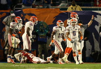 MIAMI - JANUARY 08:  The Florida Gators defense celebrates after the stopped Chris Brown #29 of the Oklahoma Sooners on a fourth and goal play in the second quarter during the FedEx BCS National Championship game at Dolphin Stadium on January 8, 2009 in Miami, Florida.  (Photo by Doug Benc/Getty Images)
