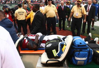 EAST RUTHERFORD, NJ - SEPTEMBER 28:  Anquan Boldin #81 of the Arizona Cardinals is taken from the field after colliding heavily with Eric Smith #33 of the New York Jets on September 28, 2008 at Giants Stadium in East Rutherford, New Jersey.  (Photo by Chris McGrath/Getty Images)