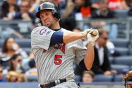 NEW YORK - MAY 17: Michael Cuddyer #5 of the Minnesota Twins bats against the New York Yankees on May 17, 2009 at Yankee Stadium in the Bronx borough of New York City. The Yankees defeated the Twins 3-2 in ten innings. (Photo by Jim McIsaac/Getty Images)