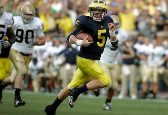 ANN ARBOR, MI - SEPTEMBER 12:  Quarterback Tate Forcier #5 of Michigan runs for a touchdown late in the fourth quarter against Notre Dame at Michigan Stadium on September 12, 2009 in Ann Arbor, Michigan.  (Photo by Domenic Centofanti/Getty Images)
