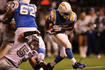 OAKLAND, CA - SEPTEMBER 14:  Darren Sproles #43 of the San Diego Chargers scores the game-winning touchdown on a 5-yard rushing TD in the fourth quarter against Ricky Brown #57 of the Oakland Raiders on September 14, 2009 at the Oakland-Alameda County Coliseum in Oakland, California.  (Photo by Ezra Shaw/Getty Images)