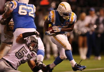 OAKLAND, CA - SEPTEMBER 14:  Darren Sproles #43 of the San Diego Chargers scores the game-winning touchdown on a 5-yard rushing TD in the fourth quarter against Ricky Brown #57 of the Oakland Raiders on September 14, 2009 at the Oakland-Alameda County Coliseum in Oakland, California.  (Photo by Ezra Shaw/Getty Images)