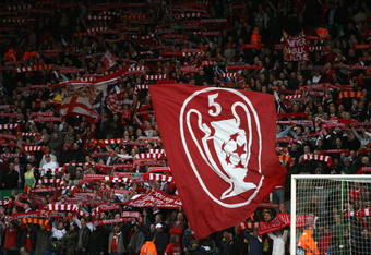 LIVERPOOL, UNITED KINGDOM - APRIL 08:  Supporters on the Kop show off their flags and scarves prior to the UEFA Champions League Quarter Final, second leg match between Liverpool and Arsenal at Anfield on April 8, 2008 in Liverpool, England.  (Photo by Clive Brunskill/Getty Images)