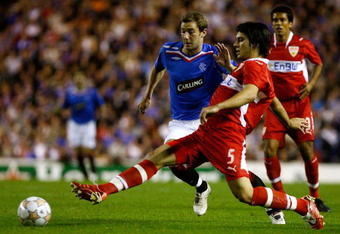 GLASGOW, UNITED KINGDOM - SEPTEMBER 19: Kevin Thomson of Rangers tackles Serdar Tasci of VfB Stuttgart during the UEFA Champions League match between Rangers and VfB Stuttgart at Ibrox Park  September 19, 2007 in Glasgow, Scotland.  (Photo by Jeff J Mitchell/Getty Images)