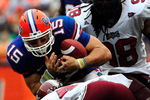 GAINESVILLE, FL - SEPTEMBER 12:  Tim Tebow #15 of the Florida Gators runs for yardage against Donnell Golden #40 of the Troy Trojans during the game at Ben Hill Griffin Stadium on September 12, 2009 in Gainesville, Florida.  (Photo by Sam Greenwood/Getty Images)