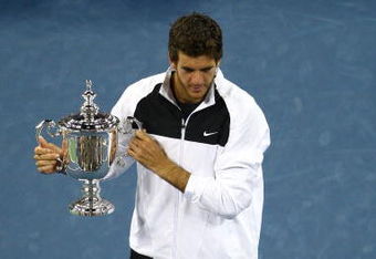 NEW YORK - SEPTEMBER 14:  Juan Martin Del Potro of Argentina holds the championship trophy after defeating Roger Federer of Switzerland in the Men's Singles final on day fifteen of the 2009 U.S. Open at the USTA Billie Jean King National Tennis Center on September 14, 2009 in the Flushing neighborhood of the Queens borough of New York City. Del Potro defeated Federer 3-6, 7-6 (7), 4-6, 7-6 (7), 6-2.  (Photo by Julian Finney/Getty Images)