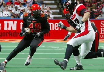 UNIONDALE, NY - APRIL 26:  Ricky Hall #49 of the New York Dragons runs the ball against the Cleveland Gladiators on April 26, 2008 at Nassau Coliseum in Uniondale, New York.  Dragons defeat Gladiators 56-39.  (Photo by Mike Stobe/Getty Images for the New York Dragons)  