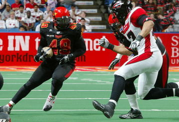 UNIONDALE, NY - APRIL 26:  Ricky Hall #49 of the New York Dragons runs the ball against the Cleveland Gladiators on April 26, 2008 at Nassau Coliseum in Uniondale, New York.  Dragons defeat Gladiators 56-39.  (Photo by Mike Stobe/Getty Images for the New York Dragons)  