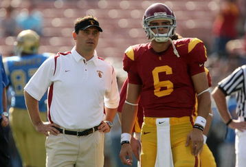 PASADENA, CA - DECEMBER 06:  Offensive coordinator Steve Sarkisian and quarterback Mark Sanchez of the USC Trojans talk during warm ups before the game against the UCLA Bruins on December 6, 2008 at the Rose Bowl in Pasadena, California.  (Photo by Stephen Dunn/Getty Images)
