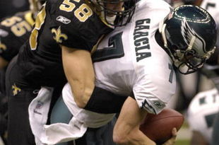 Philadelphia Eagles quarterback Jeff Garcia is sacked by  New Orleans Saints   linebacker Scott Shanle in an NFL second-round playoff game on January 13, 2007 in the Superdome in New Orleans, Louisiana.  (Photo by Al Messerschmidt/Getty Images)