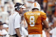 KNOXVILLE, TN - SEPTEMBER 12: Lane Kiffin, head coach of  the Tennessee Volunteers talks with Jonathan Crompton #8 of the Tennessee Volunteers during a timeout against the UCLA Bruins on September 12, 2009 at Neyland Stadium in Knoxville, Tennessee. The Bruins beat the Volunteers 19-15. (Photo by Joe Murphy/Getty Images)