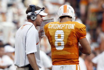 KNOXVILLE, TN - SEPTEMBER 12: Lane Kiffin, head coach of  the Tennessee Volunteers talks with Jonathan Crompton #8 of the Tennessee Volunteers during a timeout against the UCLA Bruins on September 12, 2009 at Neyland Stadium in Knoxville, Tennessee. The Bruins beat the Volunteers 19-15. (Photo by Joe Murphy/Getty Images)