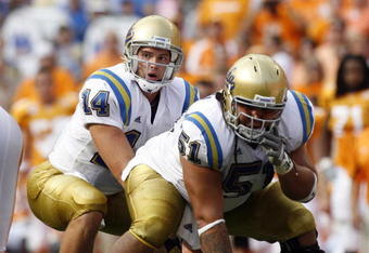 KNOXVILLE, TN - SEPTEMBER 12: Kevin Prince #14 sets himself behind Kai Maiava #51 of the UCLA Bruins against the Tennessee Volunteers on September 12, 2009 at Neyland Stadium in Knoxville, Tennessee. UCLA beat Tennessee 19-15. (Photo by Joe Murphy/Getty Images)