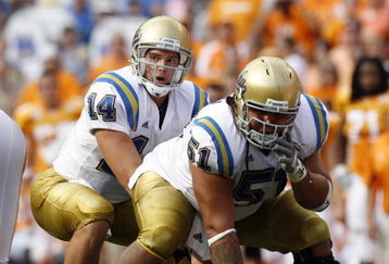 KNOXVILLE, TN - SEPTEMBER 12: Kevin Prince #14 sets himself behind Kai Maiava #51 of the UCLA Bruins against the Tennessee Volunteers on September 12, 2009 at Neyland Stadium in Knoxville, Tennessee. UCLA beat Tennessee 19-15. (Photo by Joe Murphy/Getty Images)