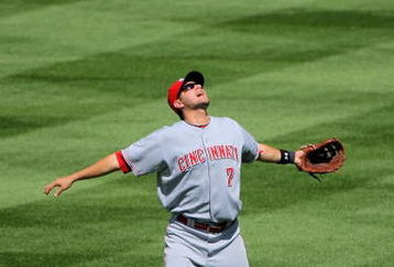 DENVER - SEPTEMBER 07:  Shortstop Paul Janish #7 of the Cincinnati Reds prepares to catch a pop fly against the Colorado Rockies at Coors Field on September 7, 2009 in Denver, Colorado. The Rockies defeated the Reds 4-3.  (Photo by Doug Pensinger/Getty Images)