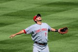 DENVER - SEPTEMBER 07:  Shortstop Paul Janish #7 of the Cincinnati Reds prepares to catch a pop fly against the Colorado Rockies at Coors Field on September 7, 2009 in Denver, Colorado. The Rockies defeated the Reds 4-3.  (Photo by Doug Pensinger/Getty Images)