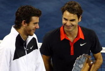 NEW YORK - SEPTEMBER 14:  (L-R) Juan Martin Del Potro of Argentina and Roger Federer of Switzerland stand with their trophies after the Men's Singles final on day fifteen of the 2009 U.S. Open at the USTA Billie Jean King National Tennis Center on September 14, 2009 in the Flushing neighborhood of the Queens borough of New York City. Del Potro defeated Federer 3-6, 7-6 (7), 4-6, 7-6 (7), 6-2.  (Photo by Julian Finney/Getty Images)