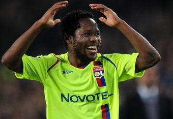 BARCELONA, SPAIN - MARCH 11:  Jean II Makoun of Lyon reacts during the UEFA Champions League, First knock-out round, second leg match between Barcelona and Lyon at the Camp Nou stadium on March 11, 2009 in Barcelona, Spain. Barcelona won the match 5-2.  (Photo by Jasper Juinen/Getty Images)