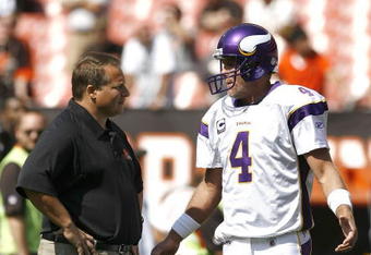 CLEVELAND - SEPTEMBER 13:  Brett Farve #4 of the Minnesota Vikings hugs Eric Mangini head coach of the Cleveland Browns talk prior to the game against the Cleveland Browns at Cleveland Browns Stadium on September 13, 2009 in Cleveland, Ohio.  (Photo by Matt Sullivan/Getty Images)