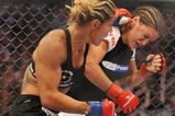 SAN JOSE, CA - AUGUST 15:  Cris Cyborg (L) battles Gina Carano during their Middleweight Championship fight at Stikeforce: Carano vs. Cyborg on August 15, 2009 in San Jose, California.  (Photo by Jon Kopaloff/Getty Images)