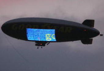 LOS ANGELES - NOVEMBER 1:  The Goodyear blimp flies in the twilight cloudy sky during the game between the Washington Huskies and the USC Trojans on November 1, 2008 at the Los Angeles Memorial Coliseum in Los Angeles, California.  USC won 56-0.  (Photo by Jeff Golden/Getty Images)