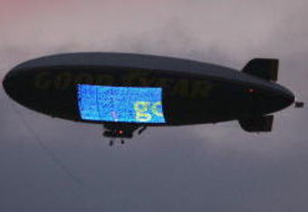 LOS ANGELES - NOVEMBER 1:  The Goodyear blimp flies in the twilight cloudy sky during the game between the Washington Huskies and the USC Trojans on November 1, 2008 at the Los Angeles Memorial Coliseum in Los Angeles, California.  USC won 56-0.  (Photo by Jeff Golden/Getty Images)