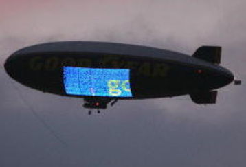 LOS ANGELES - NOVEMBER 1:  The Goodyear blimp flies in the twilight cloudy sky during the game between the Washington Huskies and the USC Trojans on November 1, 2008 at the Los Angeles Memorial Coliseum in Los Angeles, California.  USC won 56-0.  (Photo by Jeff Golden/Getty Images)