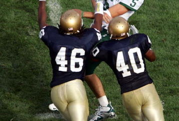 SOUTH BEND, IN - SEPTEMBER 17:  Quarterback Drew Stanton #5 of the Michigan State Spartans is pressured by linebackers Corey Mays #46 and Maurice Crum Jr. #40 of the Notre Dame Fighting Irish on September 17, 2005 at Notre Dame Stadium in South Bend, Indiana.  (Photo by Elsa/Getty Images)