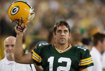 GREEN BAY, WI - SEPTEMBER 13: Aaron Rodgers #12 of the Green Bay Packers celebrates throwing the winning touchdown pass against the Chicago Bears on September 13, 2009 at Lambeau Field in Green Bay, Wisconsin. The Packers defeated the Bears 21-15.  (Photo by Jonathan Daniel/Getty Images)