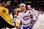 MONTREAL-APRIL 29:  Captain Saku Koivu #11 of the Montreal Canadiens and P.J. Axelsson #11 of the Boston Bruins take part in the traditional handshake following game 6 of their Eastern Conference first round playoff series at the Molson Center in Montreal, Quebec, Canada on April 29, 2002. The Canadiens won 2-1 to win the series four games to two. Photo by Dave Sandford/Getty Images/NHLI