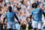 MANCHESTER, ENGLAND - SEPTEMBER 12:  Emmanuel Adebayor of Manchester City celebrates with team-mate Kolo Toure after scoring during the Barclays Premier League match between Manchester City and Arsenal at the City of Manchester Stadium on September 12, 2009 in Manchester, England.  (Photo by Shaun Botterill/Getty Images)