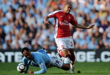 MANCHESTER, ENGLAND - SEPTEMBER 12:  Gael Clichy (R) of Arsenal is tackled by Joleon Lescott during the Barclays Premier League match between Manchester City and Arsenal at the City of Manchester Stadium on September 12, 2009 in Manchester, England.  (Photo by Shaun Botterill/Getty Images)