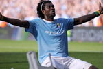 MANCHESTER, ENGLAND - SEPTEMBER 12:  Emmanuel Adebayor of Manchester City celebrates in front of the Arsenal fans after scoring during the Barclays Premier League match between Manchester City and Arsenal at the City of Manchester Stadium on September 12, 2009 in Manchester, England.  (Photo by Shaun Botterill/Getty Images)