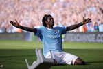MANCHESTER, ENGLAND - SEPTEMBER 12:  Emmanuel Adebayor of Manchester City celebrates in front of the Arsenal fans after scoring during the Barclays Premier League match between Manchester City and Arsenal at the City of Manchester Stadium on September 12, 2009 in Manchester, England.  (Photo by Shaun Botterill/Getty Images)