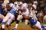 OAKLAND, CA - SEPTEMBER 14:  Darren McFadden #20 of the Oakland Raiders runs the ball against Stephen Cooper #54 of the San Diego Chargers on September 14, 2009 at the Oakland-Alameda County Coliseum in Oakland, California.  (Photo by Ezra Shaw/Getty Images)