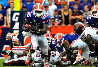 GAINESVILLE, FL - SEPTEMBER 12:  Brandon James #25 runs for a touchdown during the game against the Troy Trojans at Ben Hill Griffin Stadium on September 12, 2009 in Gainesville, Florida.  (Photo by Sam Greenwood/Getty Images)