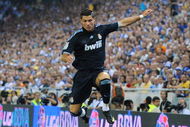 BARCELONA, SPAIN - SEPTEMBER 12: Cristiano Ronaldo of Real Madrid jumps over an Espanyol player during the La Liga match between Espanyol and Real Madrid at the Nuevo Estadio de Cornella-El Prat stadium on September 12, 2009 in Barcelona, Spain.  (Photo by Denis Doyle/Getty Images)