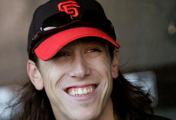 SAN FRANCISCO - AUGUST 26:  Tim Lincecum #55 of the San Francisco Giants sits in the dugout before their game against the Arizona Diamondbacks at AT&T Park on August 26, 2009 in San Francisco, California.  (Photo by Ezra Shaw/Getty Images for Reebok)